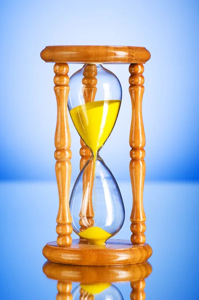 Time concept - hourglass against the gradient background — Stock Photo, Image