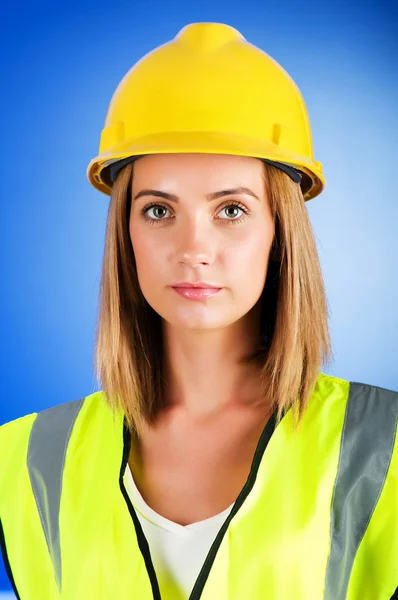 stock image Young girl with hard hat against background