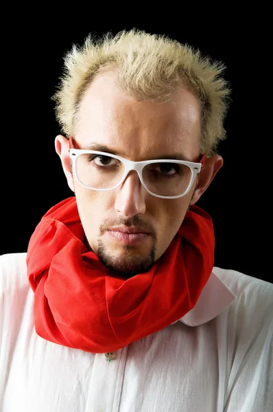 Man with red scarf on the black Stock Image