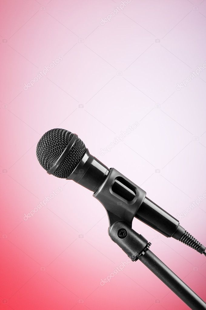 Black microphone against the colorful gradient background