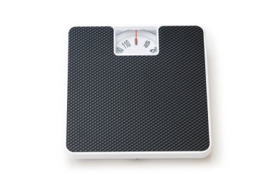 Dieting concept with scales isolated on the white clipart