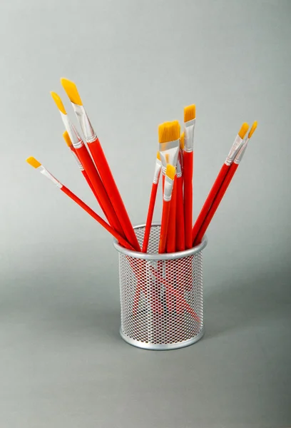 Red art brushes on the color background — Stock Photo, Image