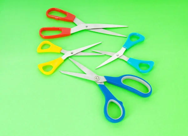 Colorful scissors on the color paper background — Zdjęcie stockowe