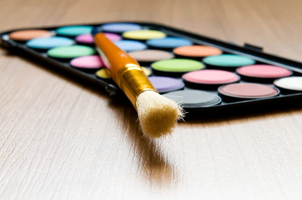 Art concept with painters palette and paint brush — Stock Photo, Image