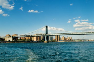 Brooklyn bridge in New York on bright summer day clipart