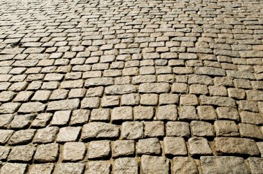 Old road paved with the cobble stones clipart