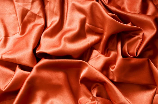 Bright satin fabric folded to be used as background — Stock Photo, Image
