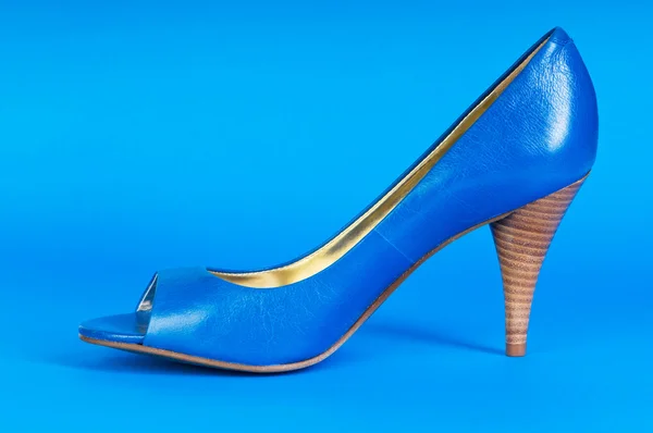 Fashion concept with blue woman shoes on high heels
