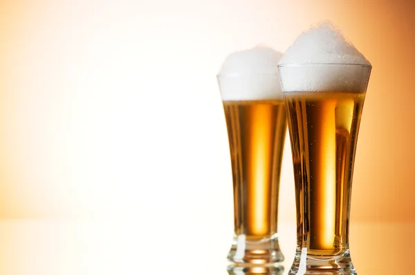 stock image Beer glasses against the colorful gradient background