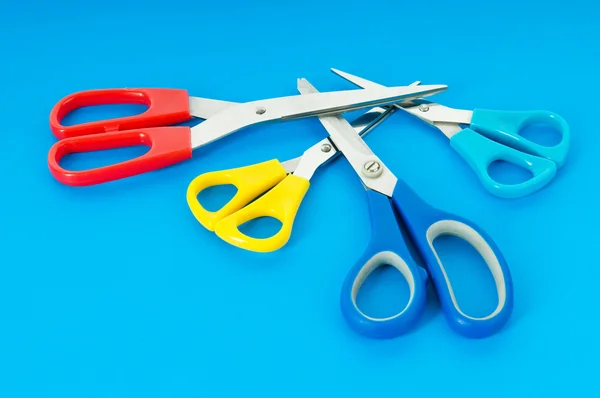 stock image Colorful scissors on the color paper background