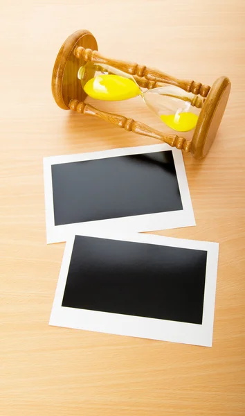 Blank Instant Photos Hour Glass Wooden Table — Stock Photo, Image