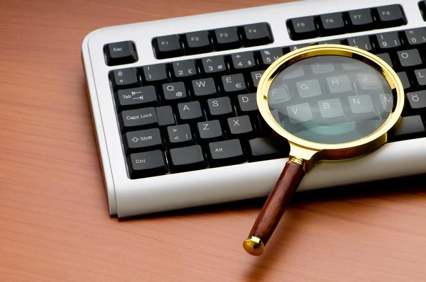 stock image Computer security concept with keyboard and magnifying glass