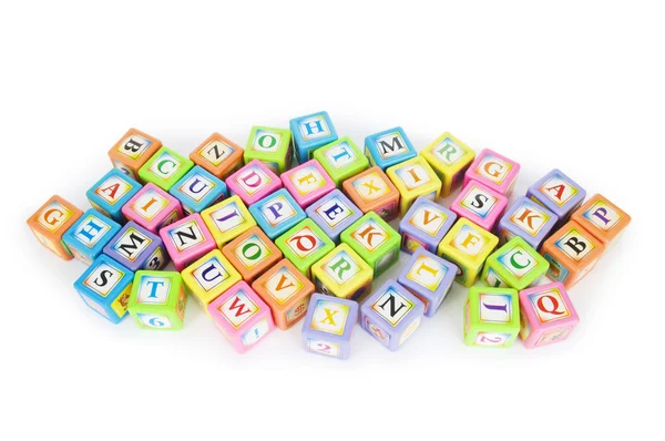 Learning and education concept - pile of alphabet blocks — Stock Photo, Image