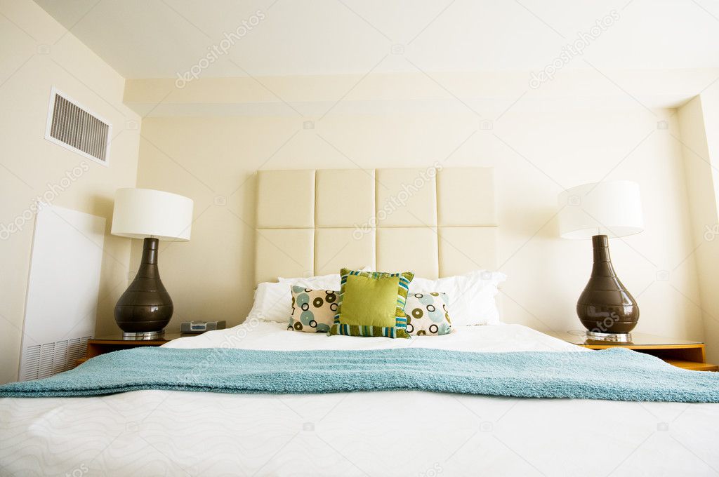 Double bed in the modern interior room