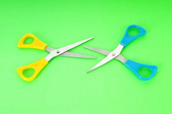 Colorful scissors on the color paper background — Zdjęcie stockowe