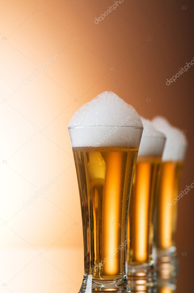 Beer glasses against the colorful gradient background