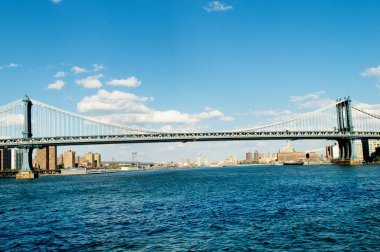 Brooklyn bridge in New York on bright summer day clipart