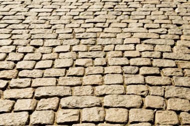 Old road paved with the cobble stones clipart