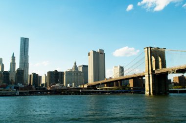 Brooklyn bridge in New York on bright summer day clipart
