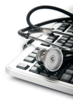 Stethoscope and keyboard illustrating concept of digital security clipart