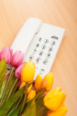 Romantic concept with phone and tulip flowers clipart