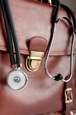 Doctor's brown leather case with the stethoscope clipart