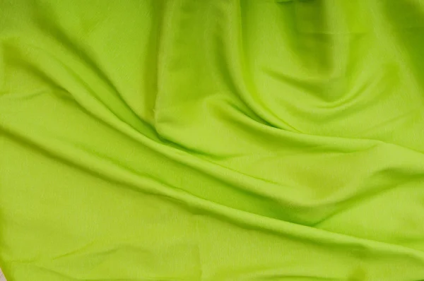 Arka planı olarak kullanılmak üzere katlanmış parlak saten kumaş — Stok fotoğraf