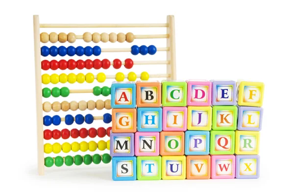 Alfabet blokken en abacus geïsoleerd op wit — Stockfoto