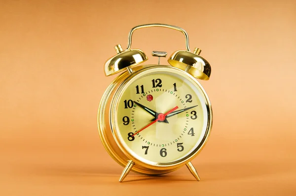 Time concept - alarm clock against colorful background — Stock Photo, Image