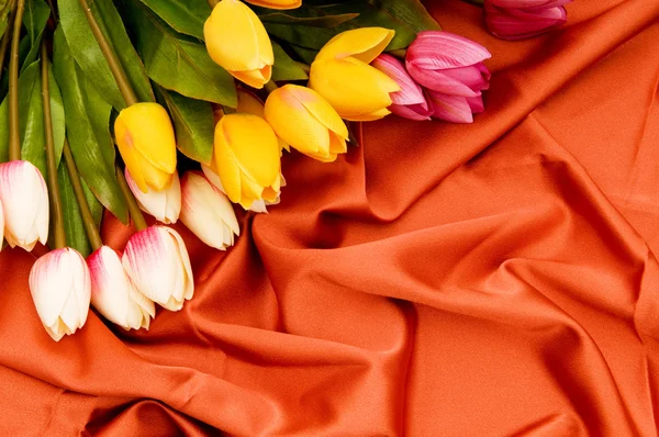 Many Flowers Red Satin Background — Stock Photo, Image