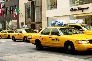 Famous New York yellow taxi cabs in motion clipart