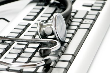 Stethoscope and keyboard illustrating concept of digital security clipart