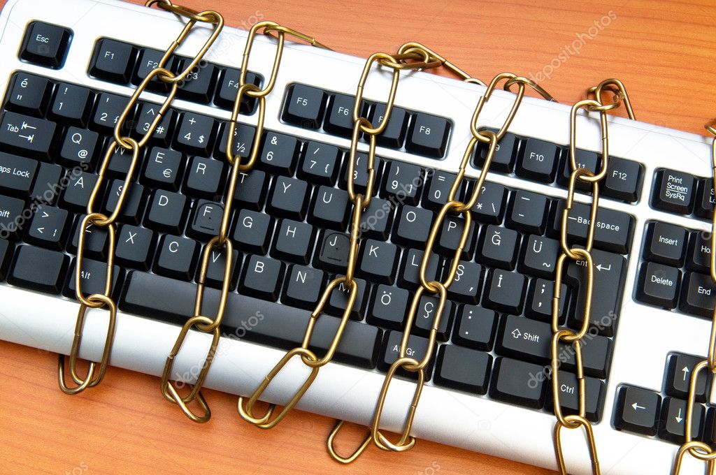 Computer security concept with keyboard and chain