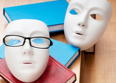 Reading concept with masks, books and glasses