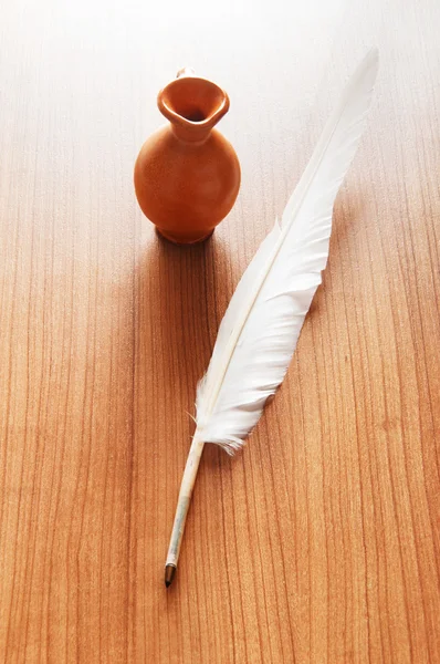 Writing feather on the background — Stock Photo, Image