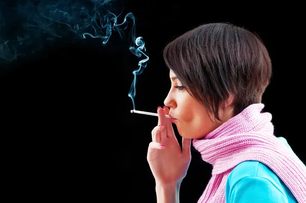 Young girl smoking on black — Stock Photo, Image