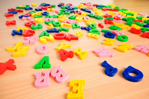 Children letters and digits on the table — Stock Photo, Image