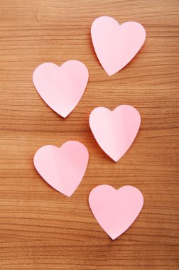 Heart shaped sticky notes on the background clipart