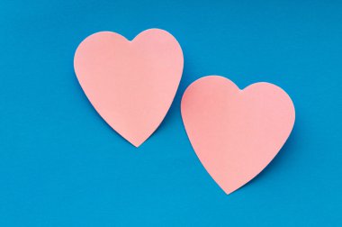 Heart shaped sticky notes on the background clipart