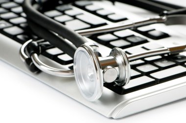 Stethoscope and keyboard illustrating concept of digital securit clipart