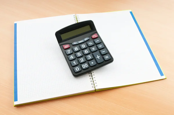 Affärsidé med anteckningar och miniräknare — Stockfoto