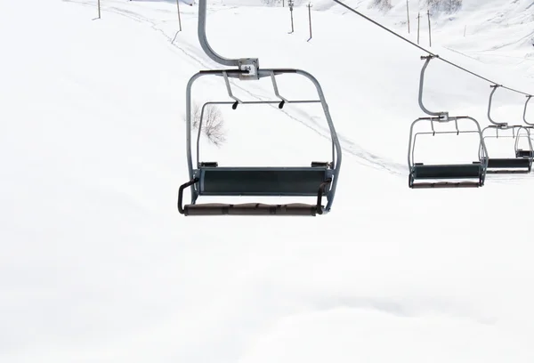 Ski lift chairs on bright winter day — Stock Photo, Image