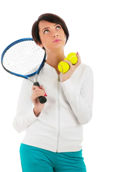 Mladá dívka s tenisovou raketou a bal izolované na bílém — Stock fotografie