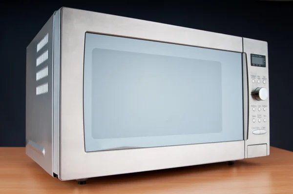 Microwave oven on the table — Stock Photo, Image