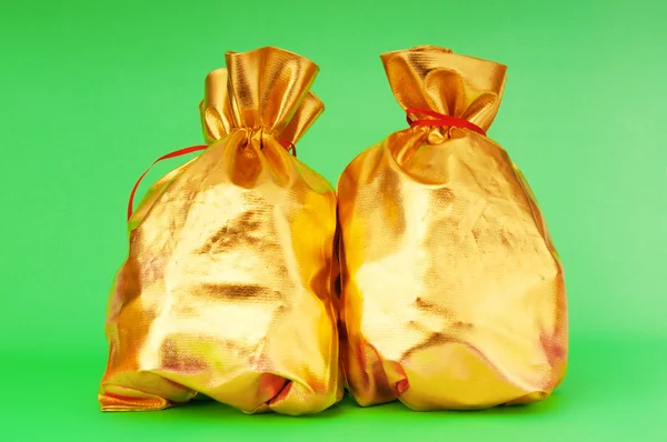 Golden sacks full of something good — Stock Photo, Image