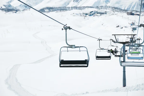 Ski lift chairs on bright winter day — Stock Photo, Image
