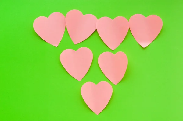 Poznámky sticky notes na pozadí ve tvaru srdce — Stock fotografie
