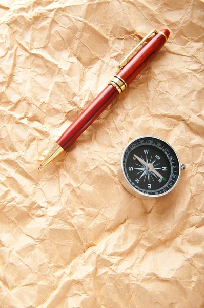 Vintage compass on the paper in adventure concept — Stock Photo, Image