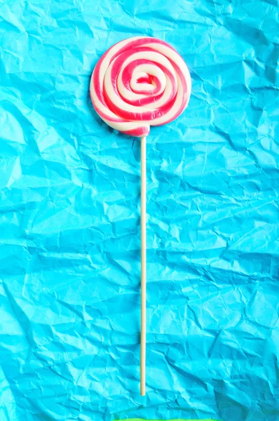 पृष्ठभूमि के खिलाफ रंगीन lollipop — स्टॉक फ़ोटो, इमेज