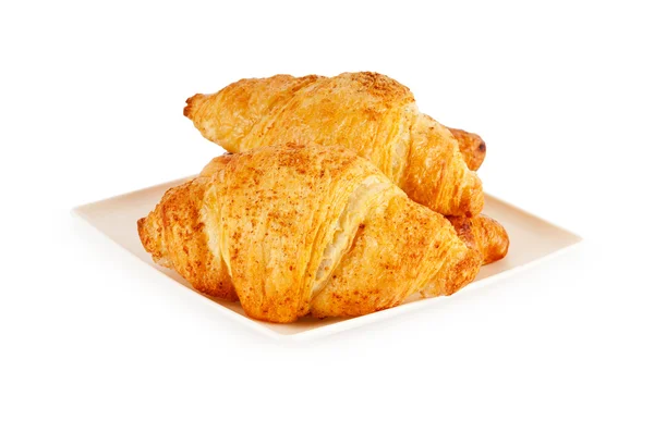 Snídaně koncepce - croissant izolovaných na bílém — Stock fotografie